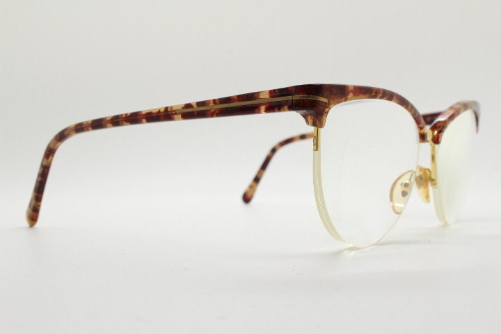 Versace 90s vintage brow line cat eye glasses made in Italy. Elegant tortoise acetate cateye optical half frames. Prescription RX eyeglasses