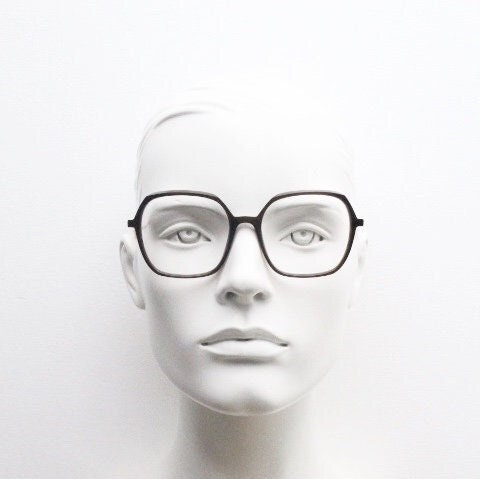 Caroline Abram square hexagon eye glasses model Caline. Dark brown acetate optical frame with pink arms. Prescription RX spectacles