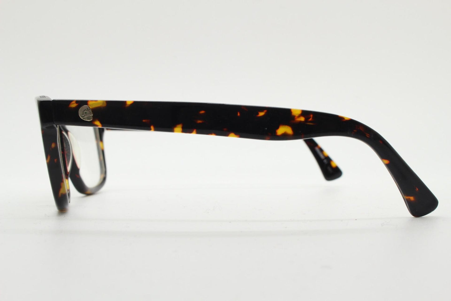Cheap Monday rectangular low profile eye glasses. Dark brown tortoise gloss finish acetate optical frames. Prescription RX spectacles