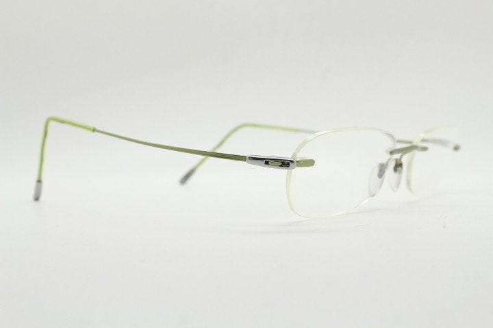 Silhouette rectangular frameless eye glasses made in Austria. Minimal lightweight optical frame with silver trim. Prescription RX