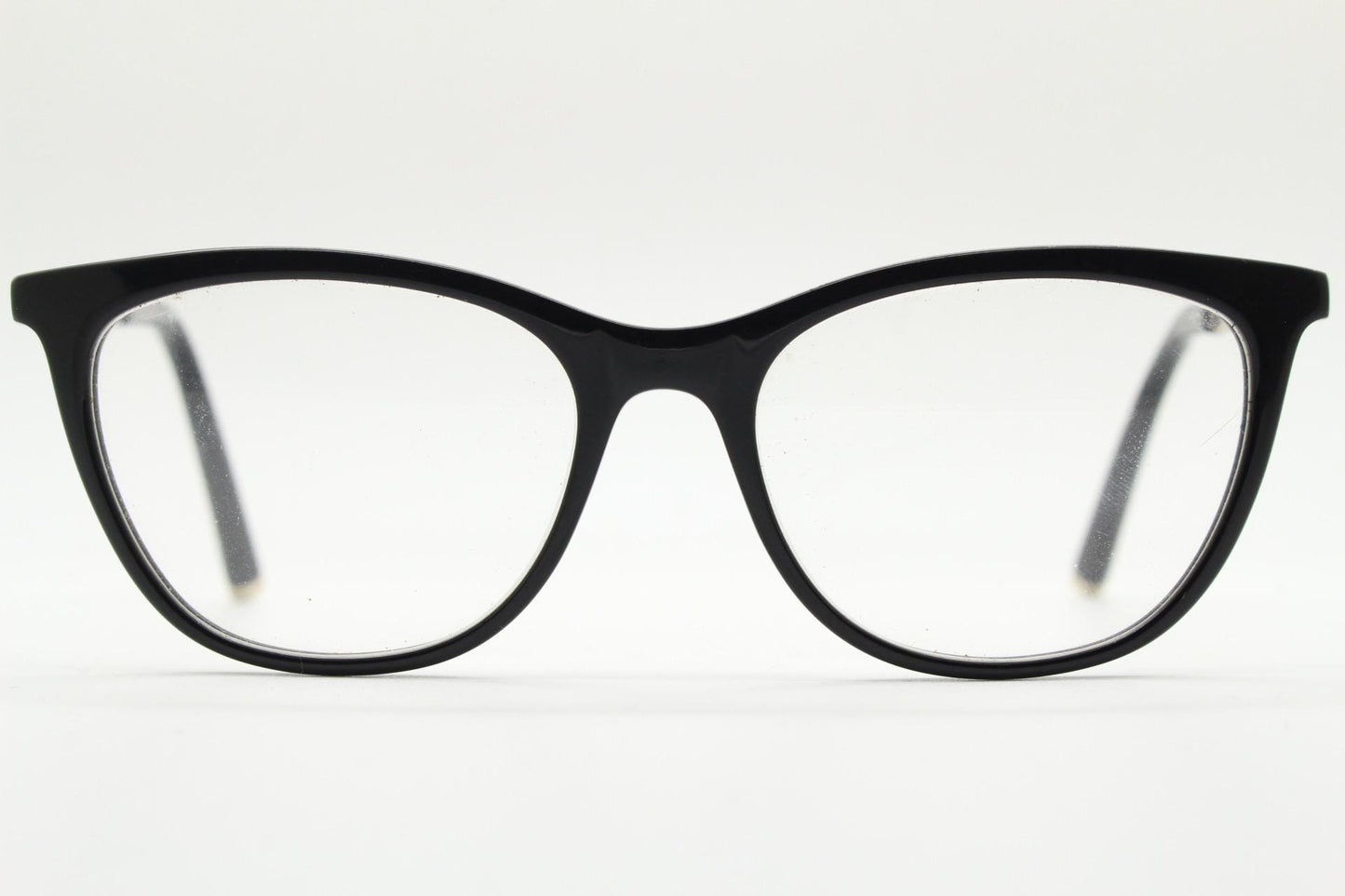 Vintage elegant cat eye glasses by Heritage. Black gloss acetate optical frames with leather lattice arms. Prescription RX cateye spectacles