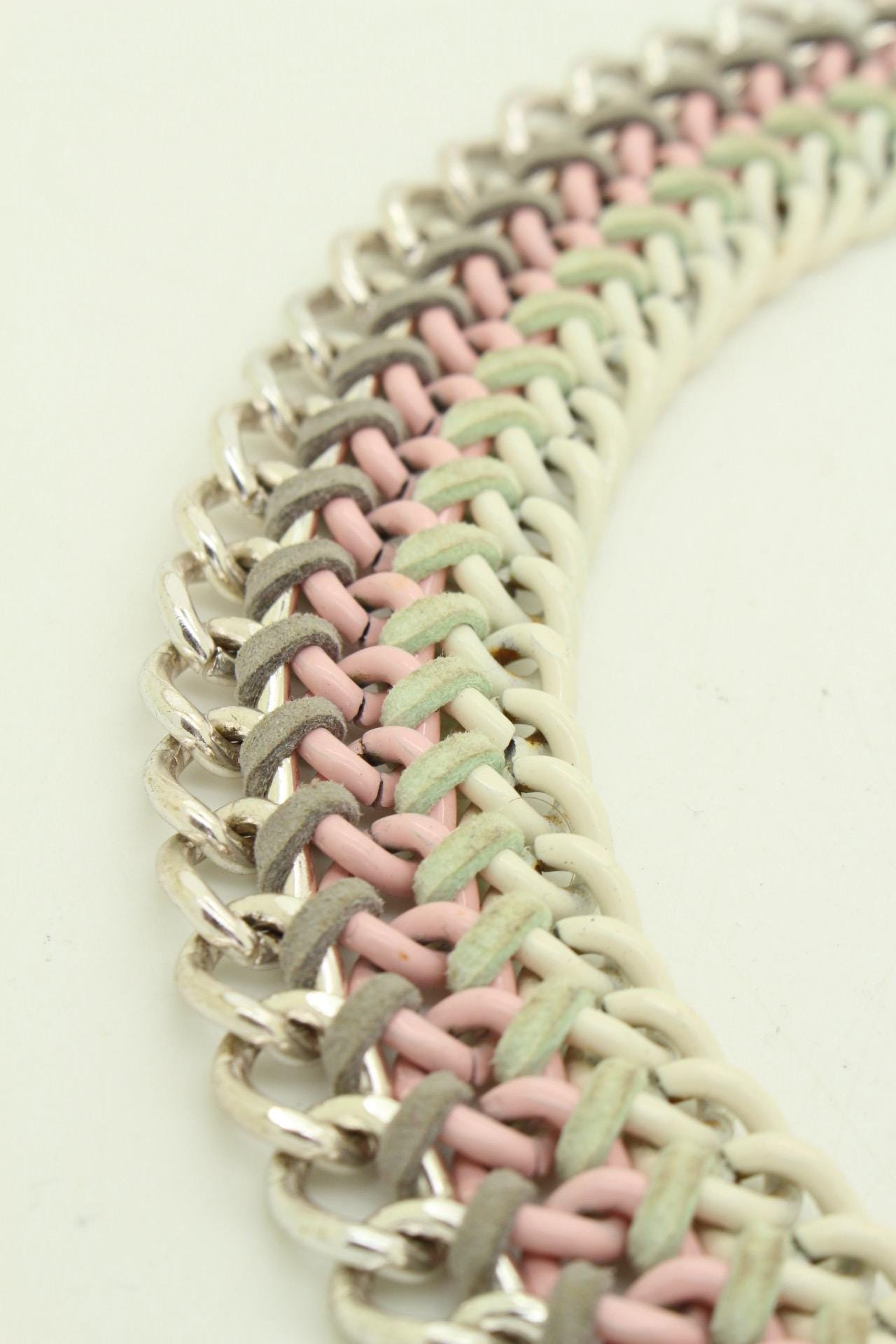 90s vintage 3 tier chain necklace. Solid metal construction in silver, pink, and white tones with grey rubber bonds. Adjustable back