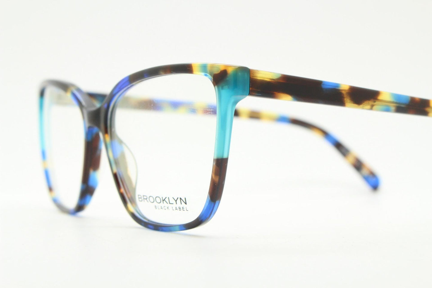 Modified cat eye glasses by Brooklyn. Vibrant blue and brown tones gloss optical frames.  Prescription eyeglasses. RX cateye spectacles