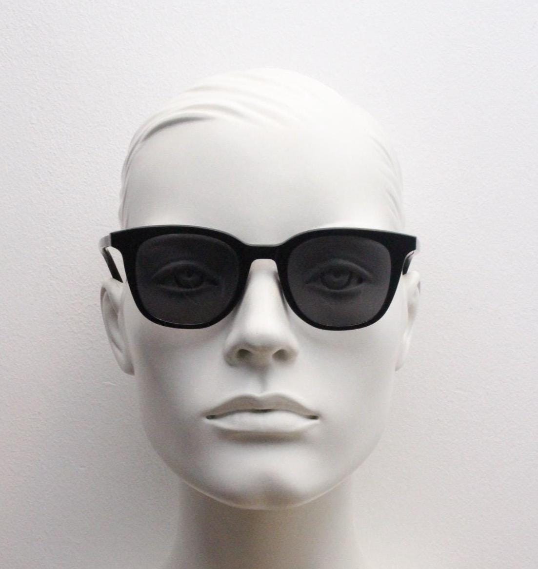 Vintage 90s slim frame black horn rim sunglasses. All time classic retro refined wayfarer design in gloss with black lenses