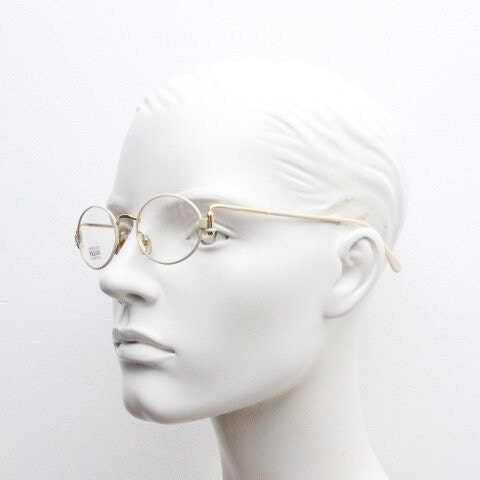 Gianfranco Ferre 90s vintage oval eye glasses made in Italy. White and gold metal tech design optical frame. Prescription RX spectacles. NOS