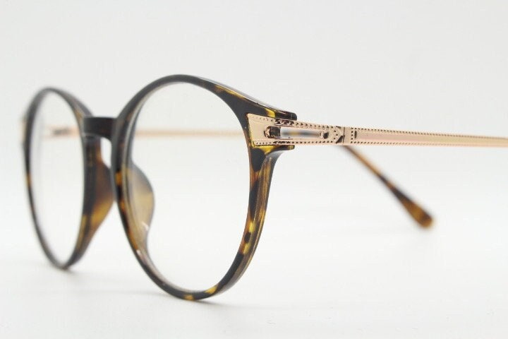 90s vintage round glasses with tortoise front and gold embossed arms. 40s, 50s style prescription optical frames. Clear lens eyeglasses. RX