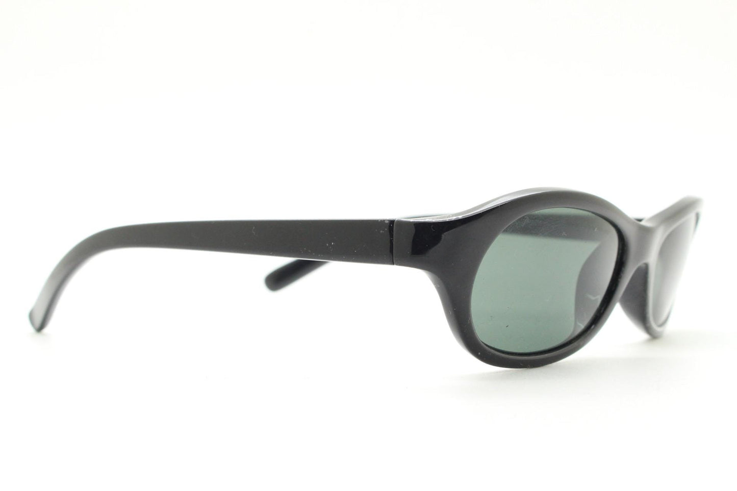 Vintage 90s oval chic cat eye sunglasses made in Italy. Minimalistic plain black acetate frame with green lenses. Womens 60s design. NOS