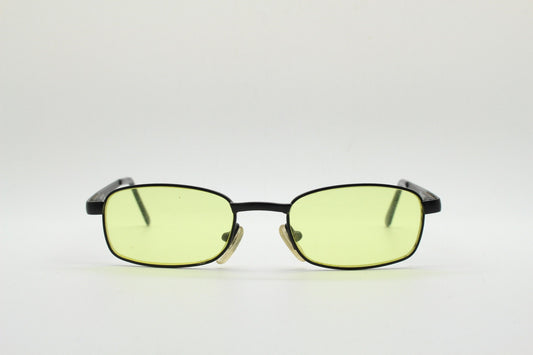 90s vintage small rectangular sunglasses. Minimal plain black matt metal frame with bright yellow lenses. Steampunk. Micro