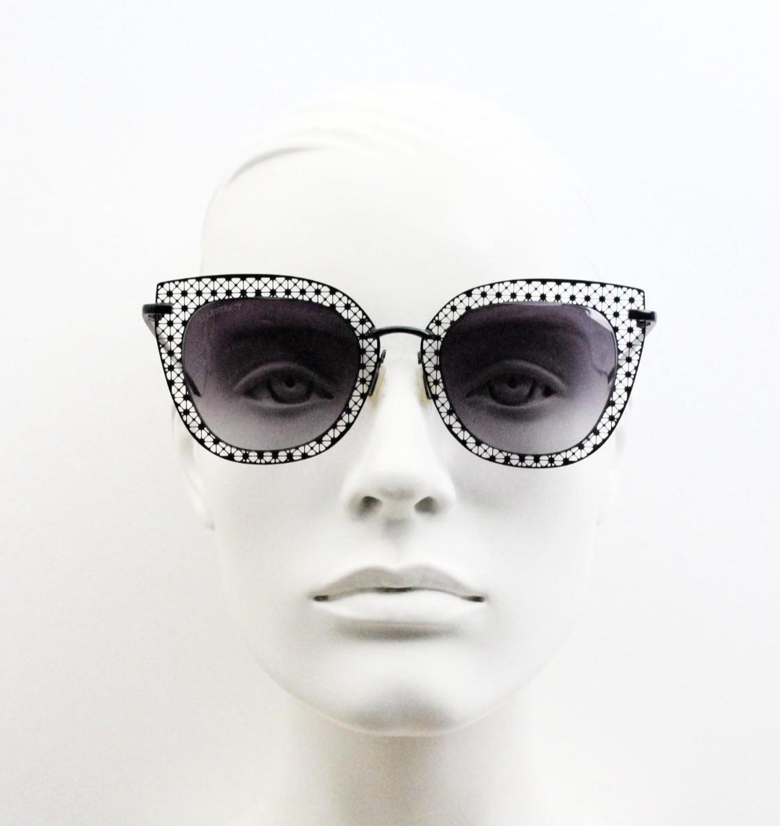 Metal cut out vintage cat eye sunglasses.  Women's imaginative black lacey pattern flat cateye frame with smoky graduating lenses