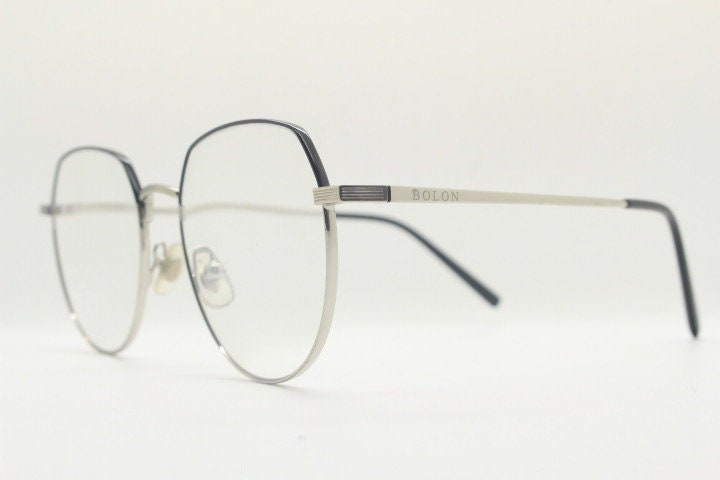 Bolon round panto flat top eye glasses model 7052. Slender silver metal optical frame with black brow. Prescription spectacles. Vintage RX
