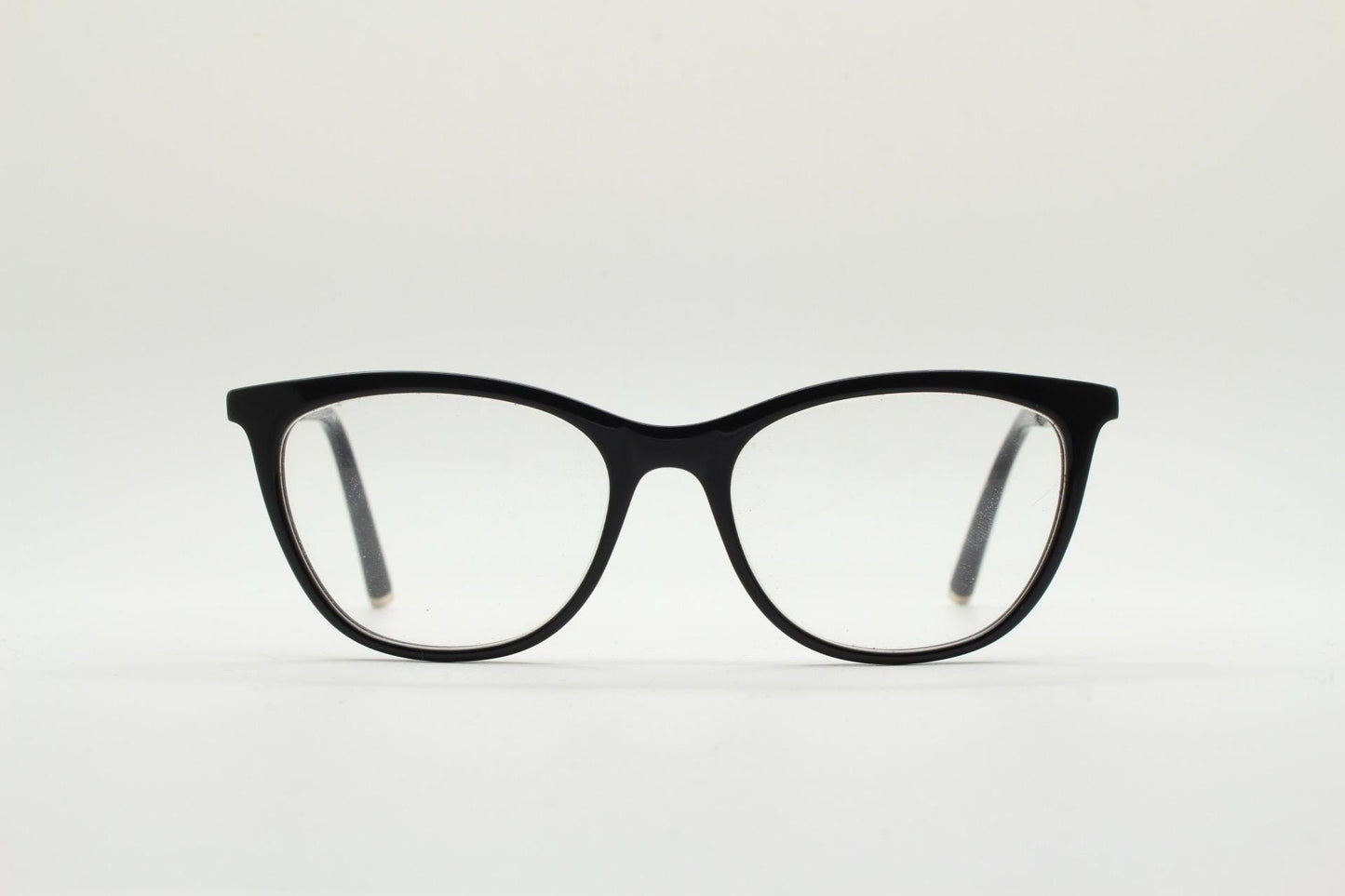 Vintage elegant cat eye glasses by Heritage. Black gloss acetate optical frames with leather lattice arms. Prescription RX cateye spectacles