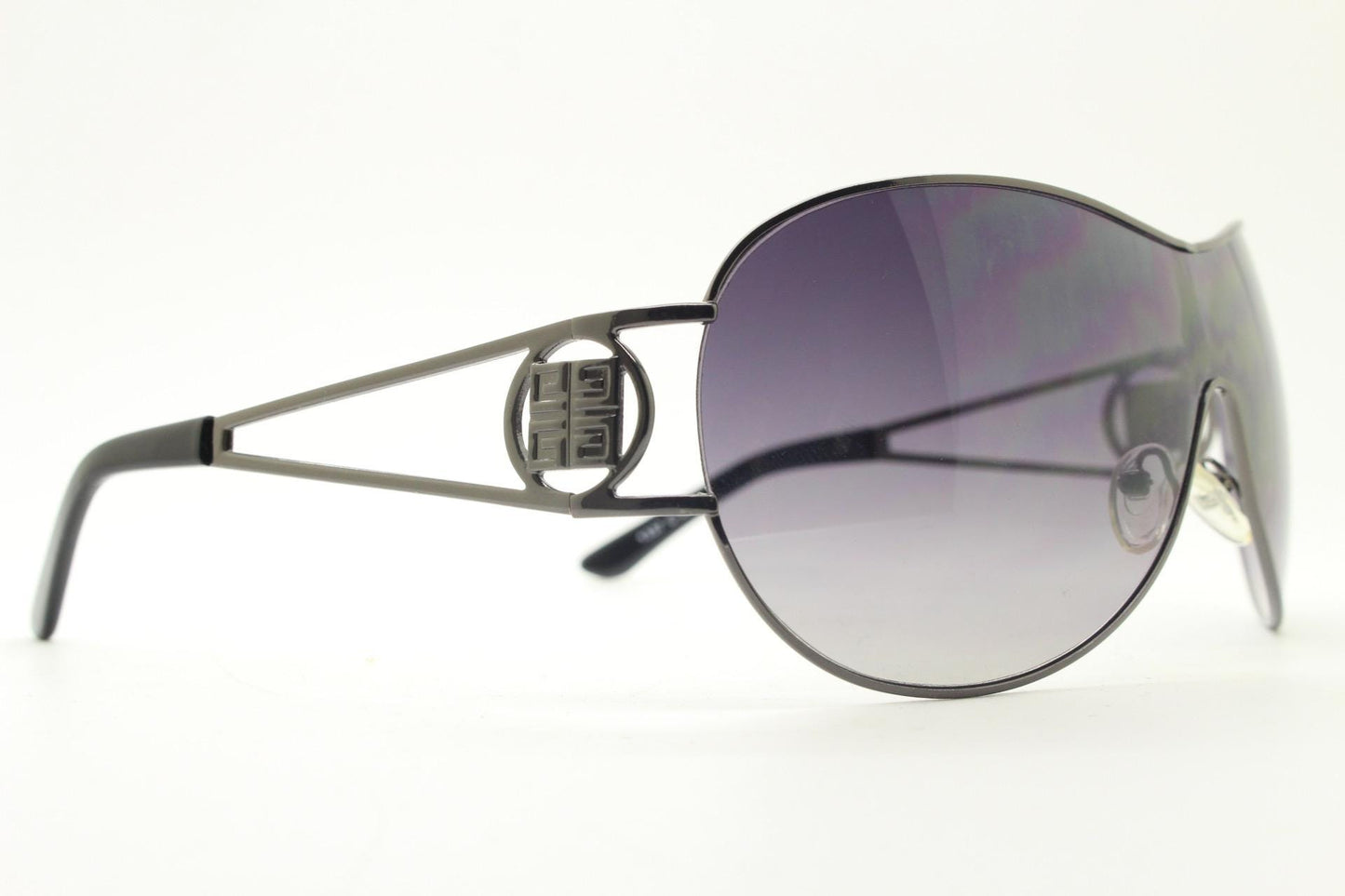Y2K vintage futuristic visor sunglasses. 2000's black wraparound mono lens mini mask shield design with target temple crest. 00's NOS
