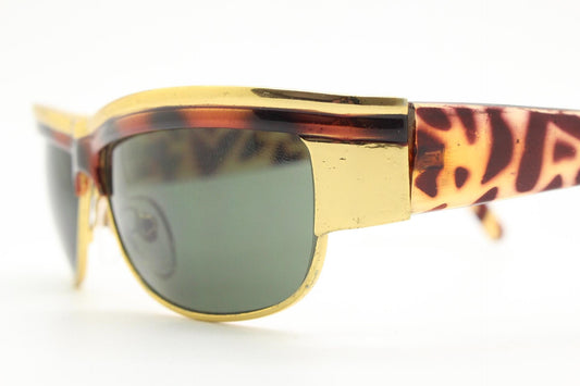 90s vintage visor shield sunglasses. Substantial metal curved wraparound frame with metallic tiger brow and abstract arm patterns. NOS. BNWT