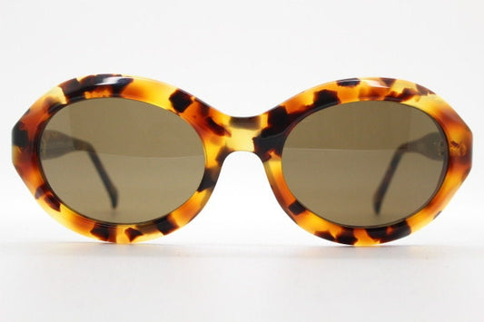 Francois Pinton Paris 90s vintage oval sunglasses made in France. Womens thick acetate frame in brown and amber tones. NOS