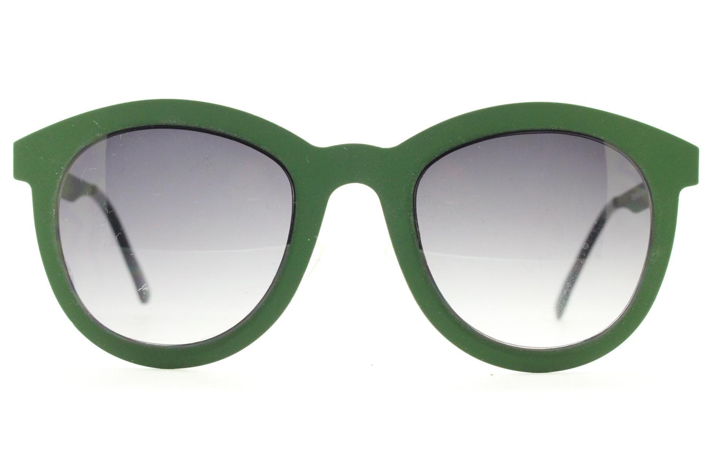 Round vintage cat eye sunglasses. Green flat metal frame in a slightly rubber finish that encases the lenses. Womens 2000s modified cateye