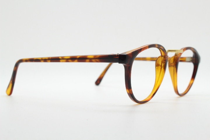 90s vintage round eye glasses. Minimal slim tortoise optical frames with gold bridge. 40s, 50s design prescription eyeglasses. RX spectacles