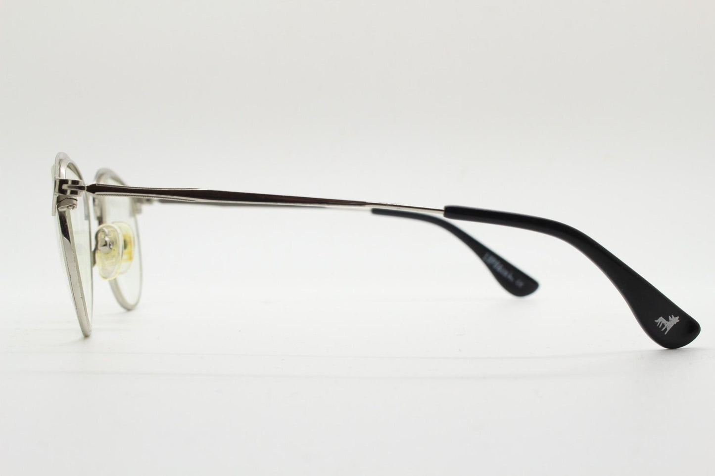 Lupo and Co round eye glasses with pointed corners. Flat metal silver optical frames with black browline. Prescription eyeglasses. RX