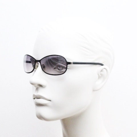 Y2K vintage mini bug eye sunglasses. Curved gunmetal grey flat metal frame with black matt arms and graduating lenses. Unused 2000s NOS