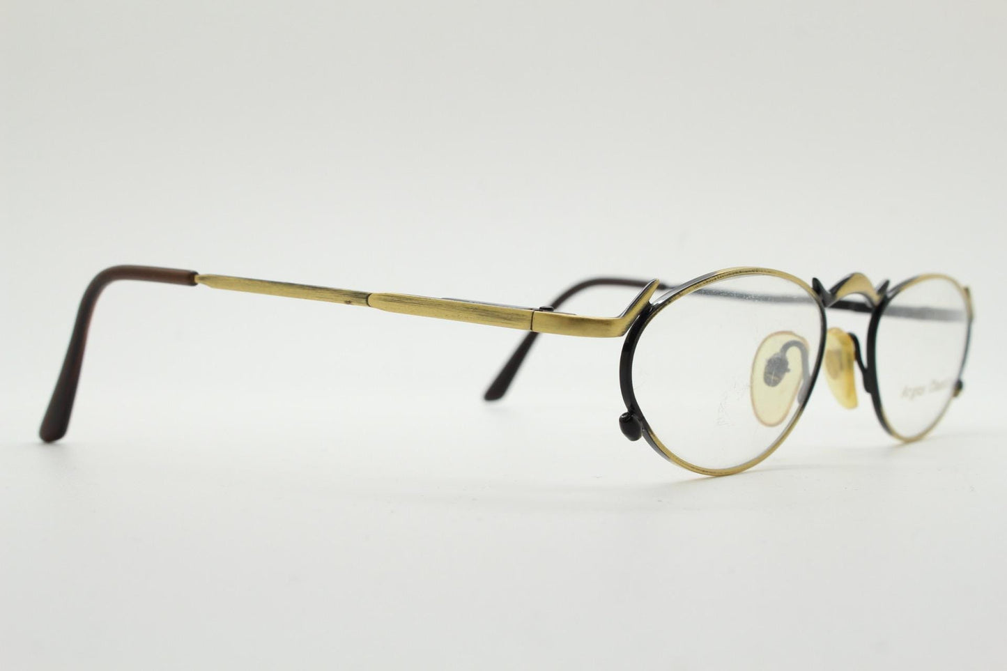 90s vintage oval eye glasses by Argus Chassis. Brushed bronze optical frames with dynamic spikes. Prescription cosplay fetish spectacles NOS