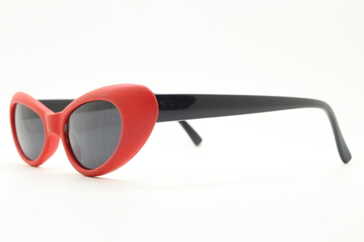 Vintage 80s oval cat eye sunglasses. Dynamic red rubber front with black gloss arms. Hyper real cosplay cateye. New wave punk