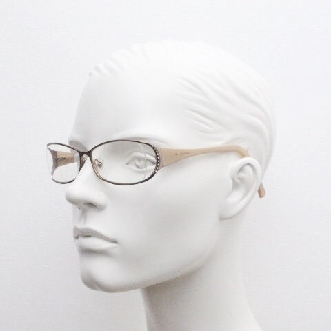 Givenchy eye glasses in brown chrome with beige acetate arms and gold diamante detail. Rhinestone optical frames. Prescription eyeglasses RX