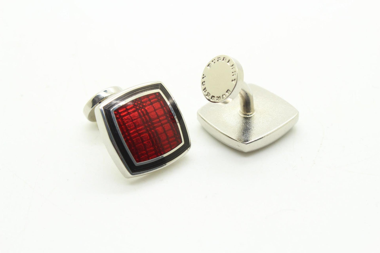 Burberry vintage square cuff links made in England. Solid metal with red enamel. Signature check on one side, plain on the other. NOS