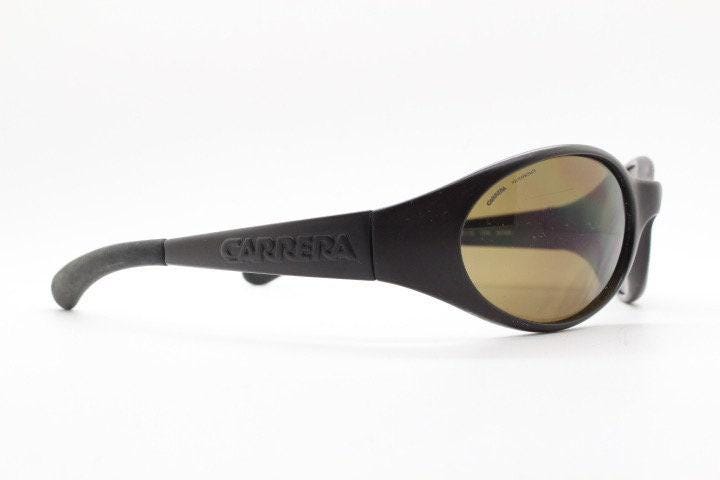 Carrera 90s vintage shield sunglasses made in Italy. Aerodynamic brown wrap around sport frame with big spell out logo. Bug eye. BNWT. NOS