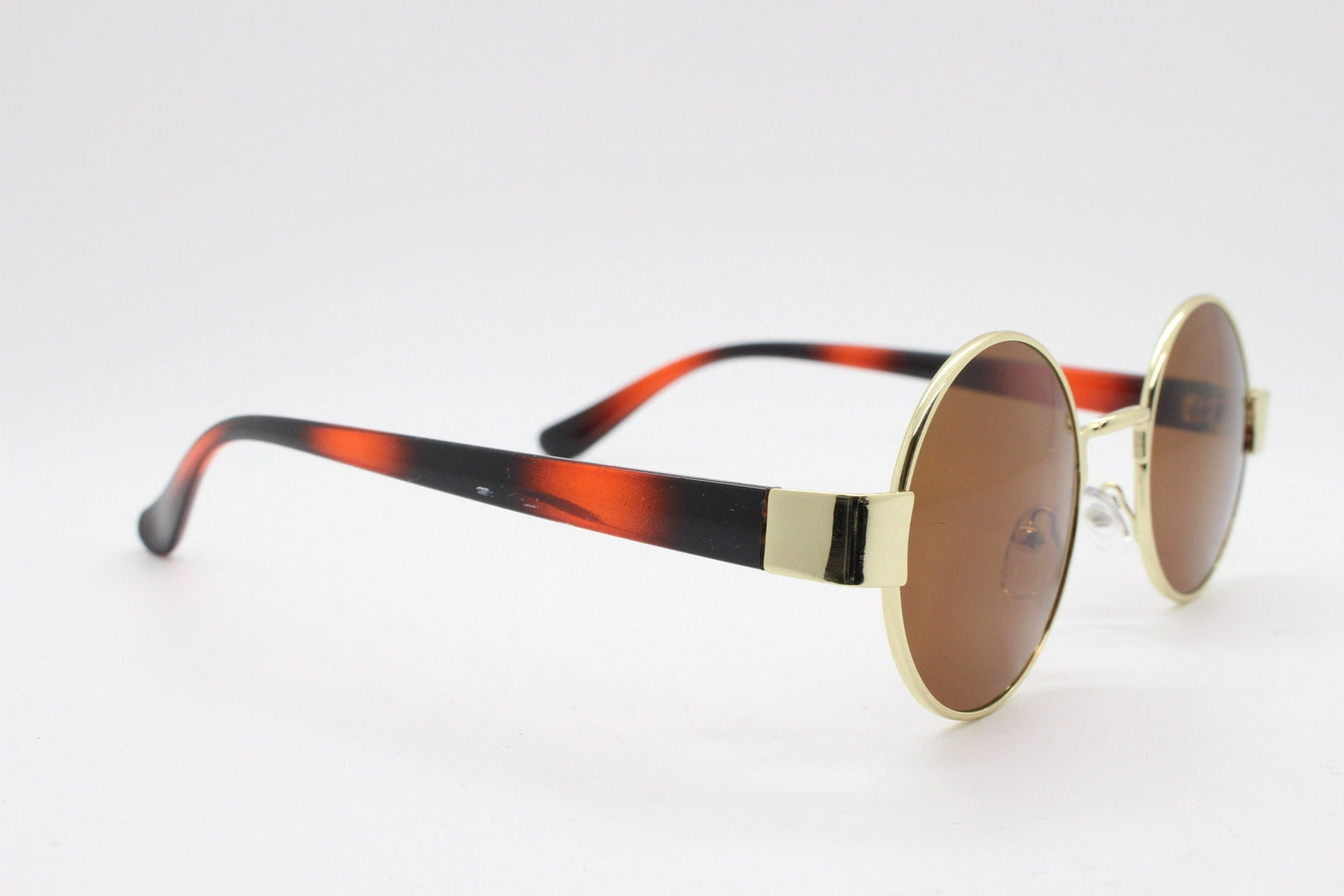 90s round vintage sunglasses. Gold 1920's style frame with tiger pattern arms and brown lenses. Unused. BNWT