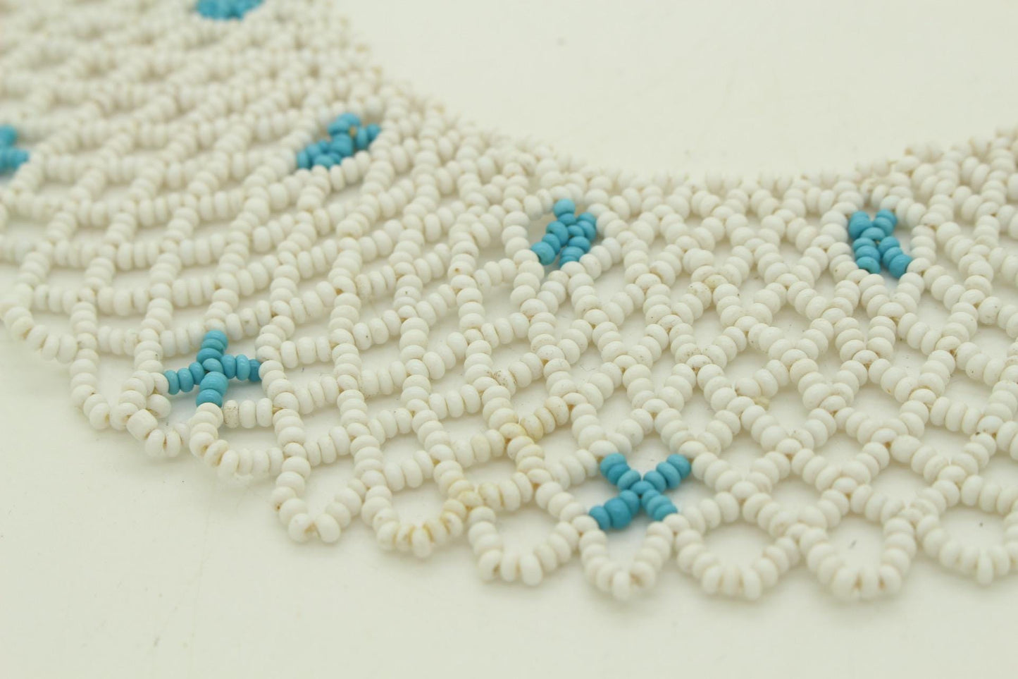 80s vintage beaded lattice collar necklace. Small white beads mixed with blue "x" patterns. Womens large versatile choker. Unused NOS