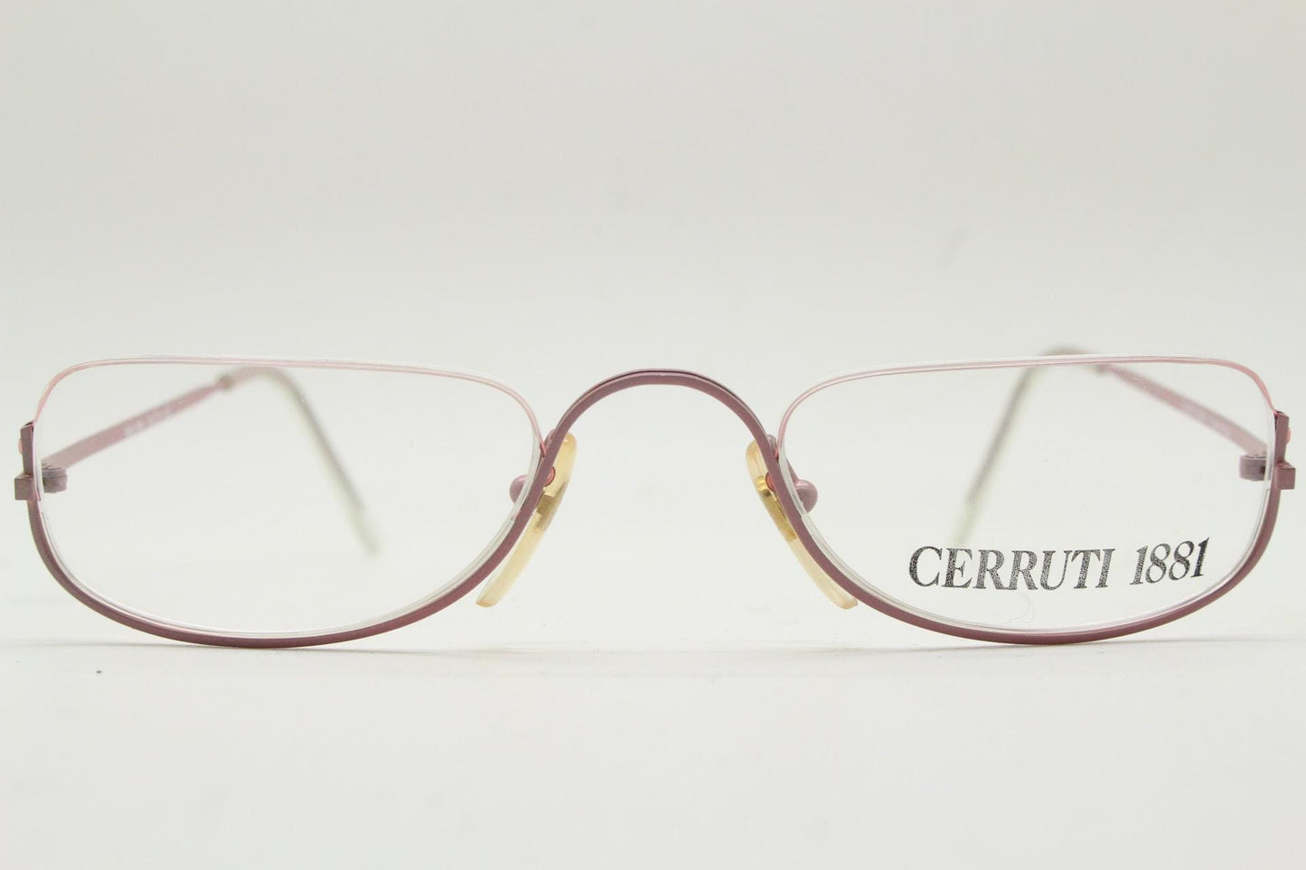 Cerruti 1881 half moon eye glasses. Pink half frame optical eyeglasses. Undulating C bridge design. 90s vintage prescription spectacles. NOS