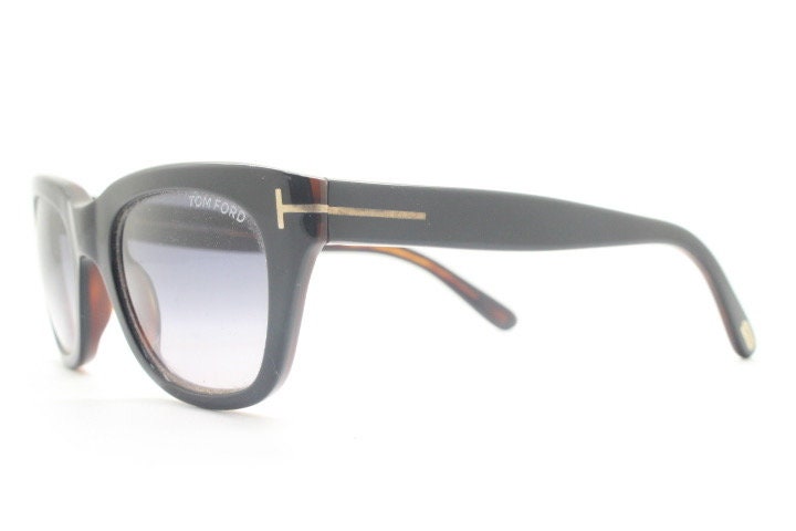 Tom Ford vintage modified wayfarer sunglasses made in Italy. Slightly cat eye form in black gloss acetate with superb graduating lenses