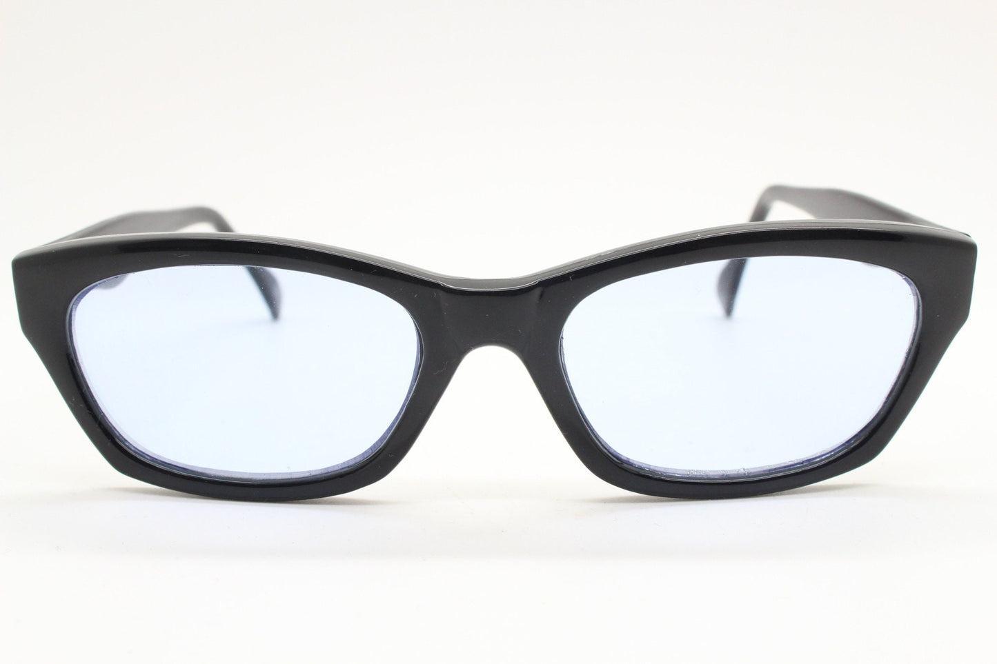 80s vintage rectangular sunglasses. Low profile 60s design black gloss frame with extra light tone sky blue lenses. BNWT Unused NOS