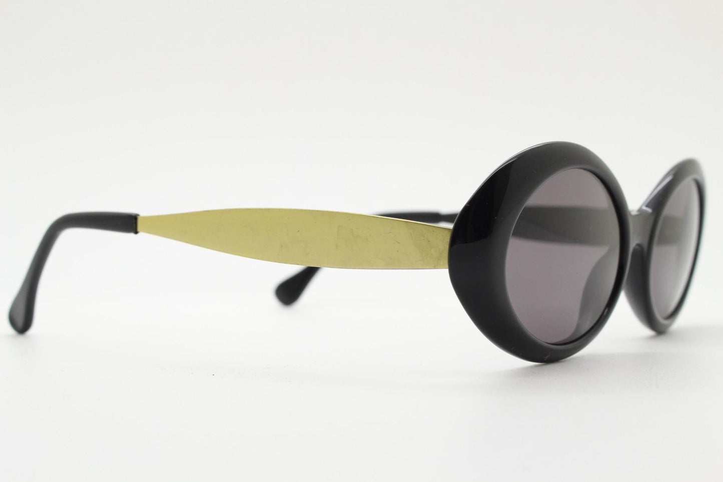 Benson and Ashley vintage 90s oval sunglasses model 406. Neat size quality 60s style acetate frame with tall flat gold arms. New Old Stock.