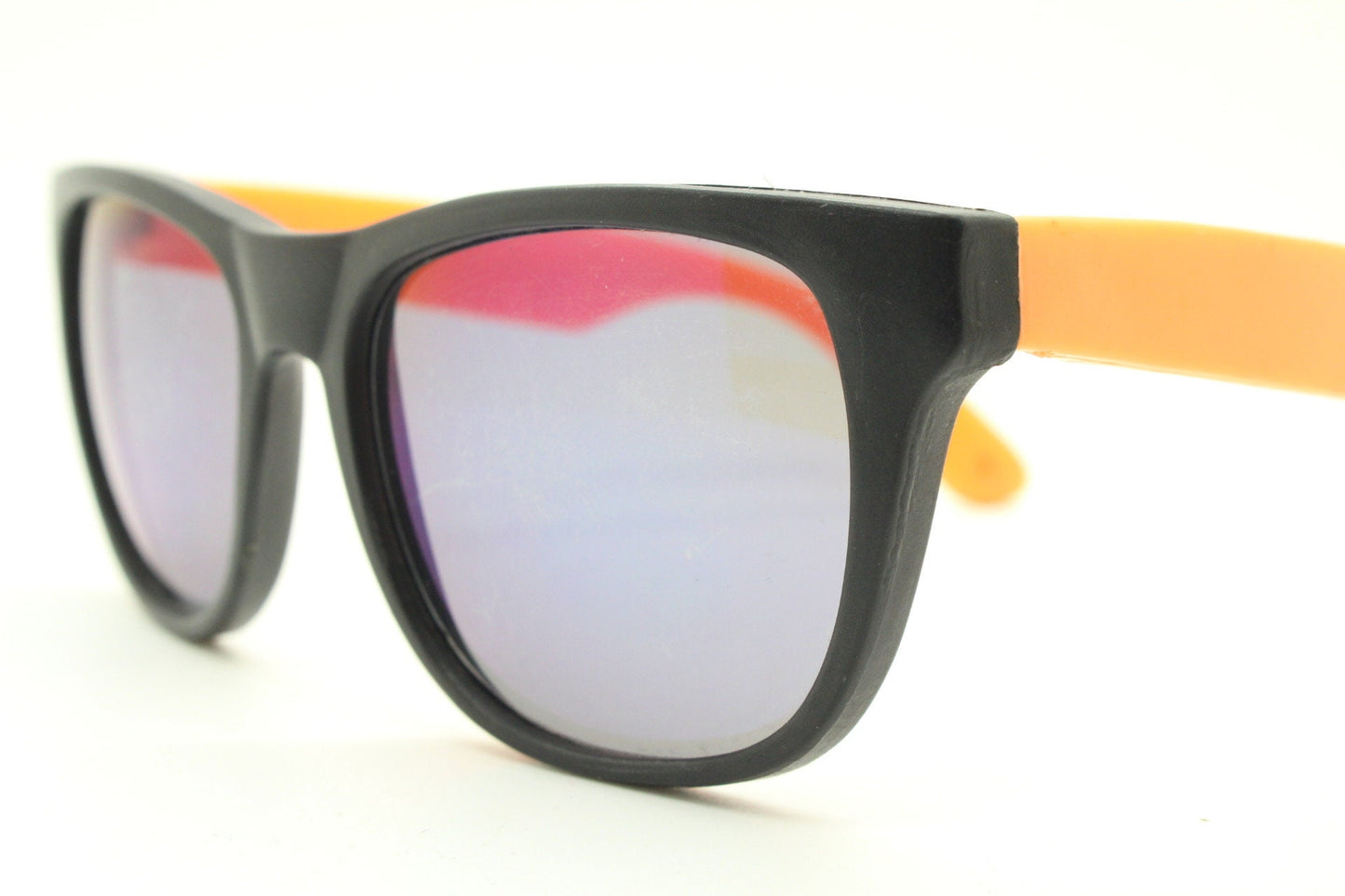 80s vintage 2 tone wayfarer style sunglasses. Matt black flexible rubber frame with orange dayglo arms. Unused NOS. Y2K fluorescent rave