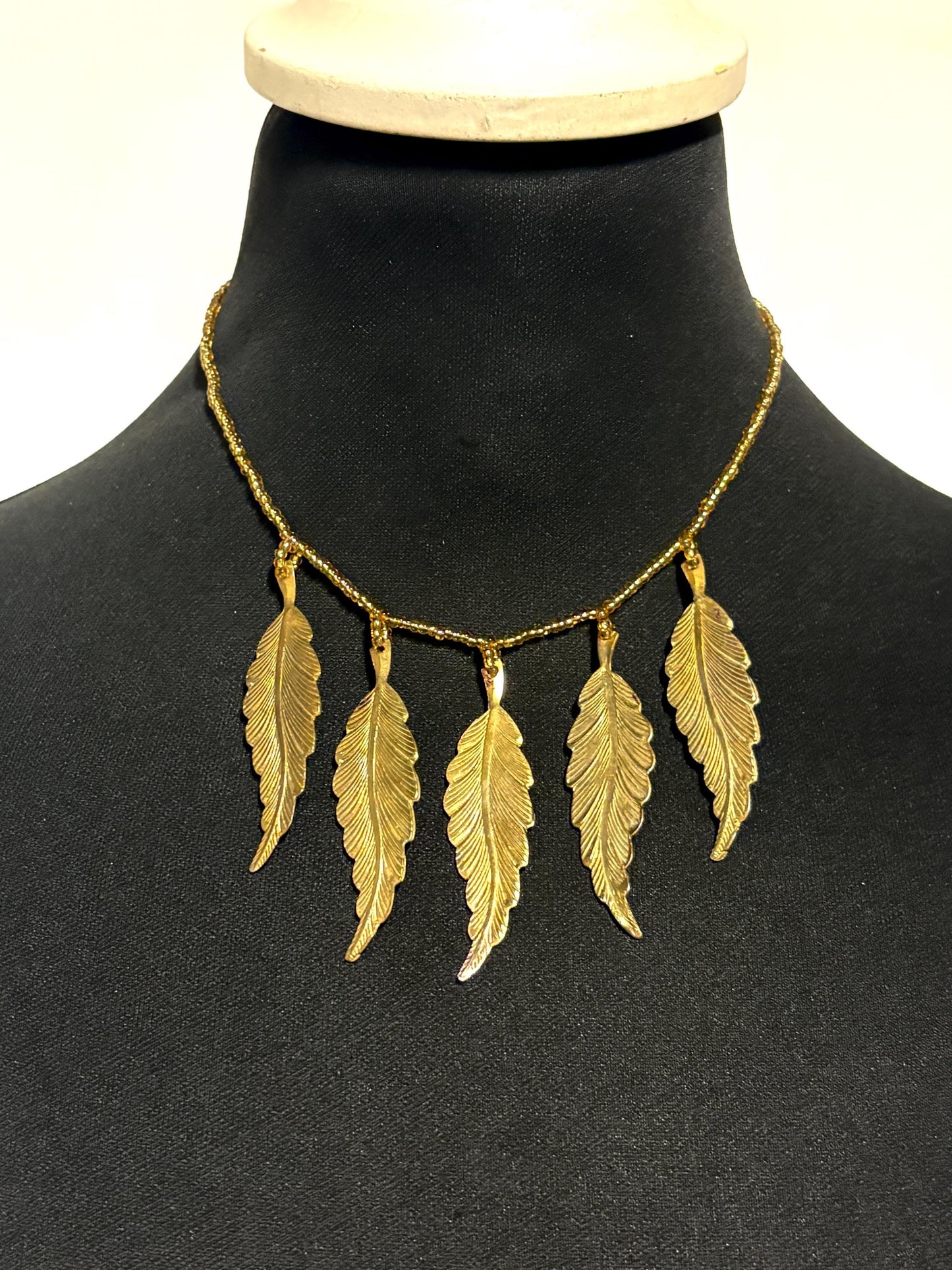 80s vintage gold beaded necklace with large dangling leaves . Charming statement piece. Country and western. Native american