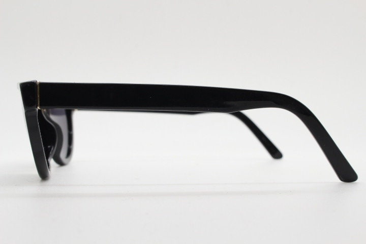 Retrosuperfuture thick flat top cat eye sunglasses hand made in Italy. All black gloss acetate frame. Vintage