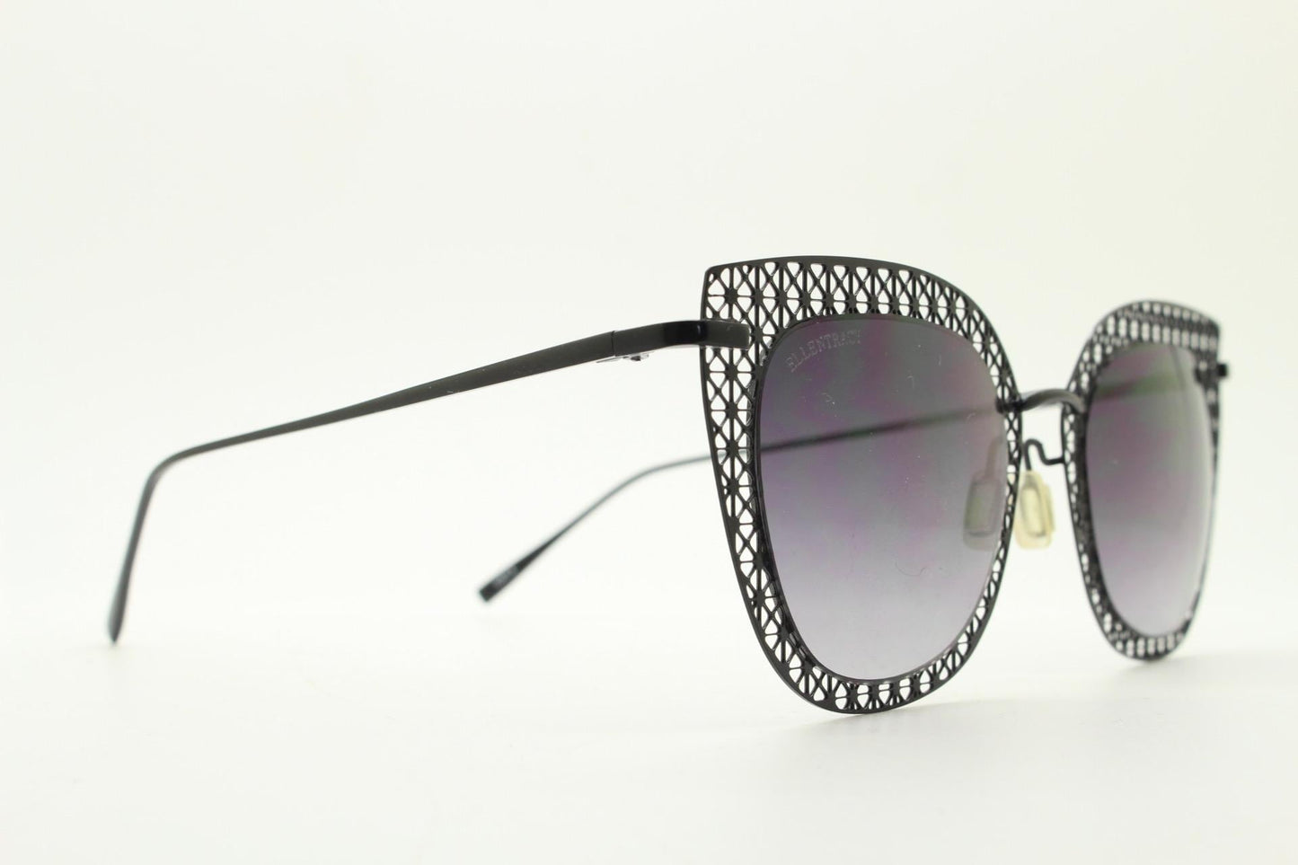 Metal cut out vintage cat eye sunglasses.  Women's imaginative black lacey pattern flat cateye frame with smoky graduating lenses