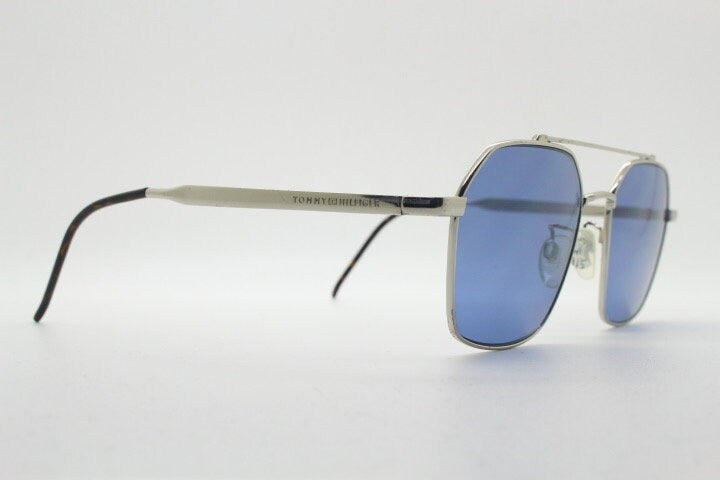 Tommy Hilfiger square aviator sunglasses with double bridge. Silver metal 6 sided frame aviators with blue lenses. Hexagon