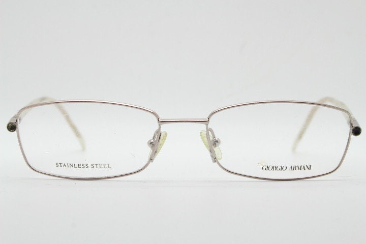 Giorgio Armani 90s vintage oval eye glasses made in Italy. Gold front with marbled white acetate arms. Optical frames. Prescription RX