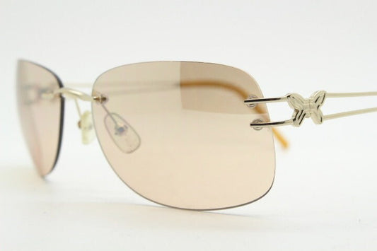 Y2K vintage rimless rectangular sunglasses. Frameless 2000's brown lens with slight mirror glaze gold trim and butterfly hinges. 00's NOS