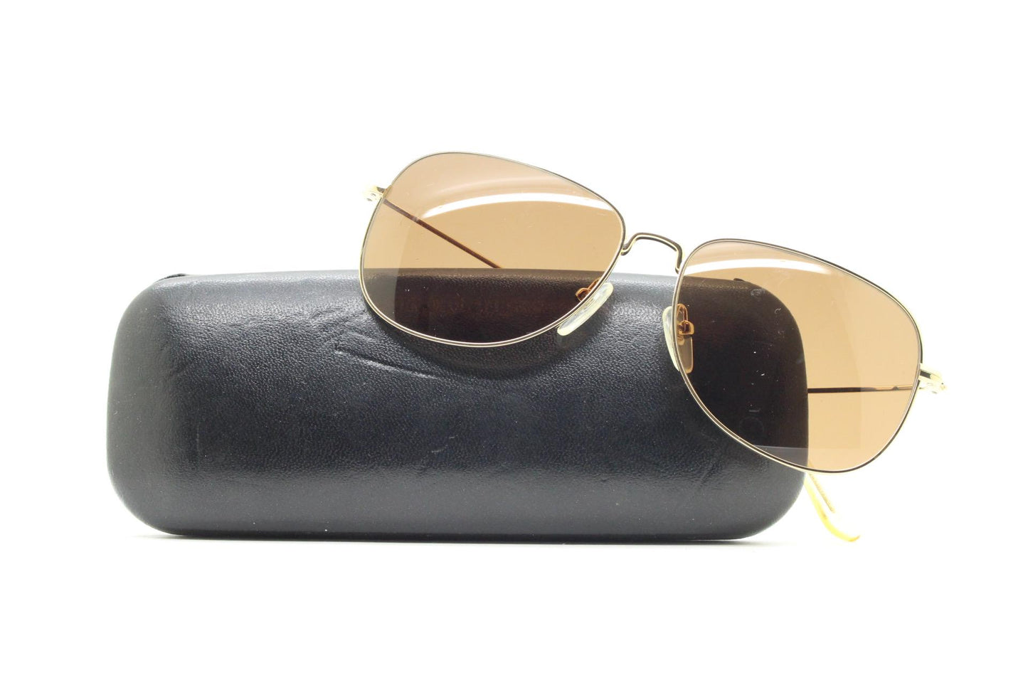 Helmut Lang rectangular 90s vintage sunglasses made in Japan. Minimal gold chrome frame with warm brown lenses. Luxury modified aviator