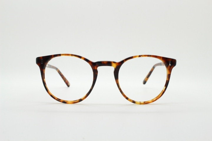Cubitts vintage round 40s design hand made eye glasses. Honey tortoise acetate optical frame with keyhole bridge. Prescription RX