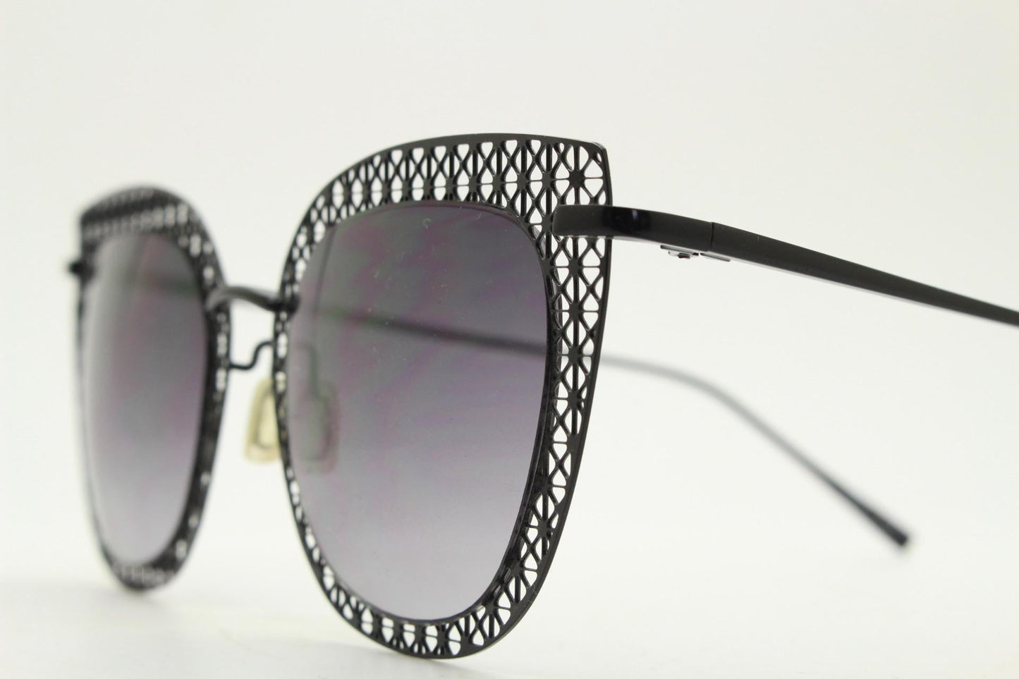 Metal cut out vintage cat eye sunglasses.  Women's imaginative black lacey pattern flat cateye frame with smoky graduating lenses