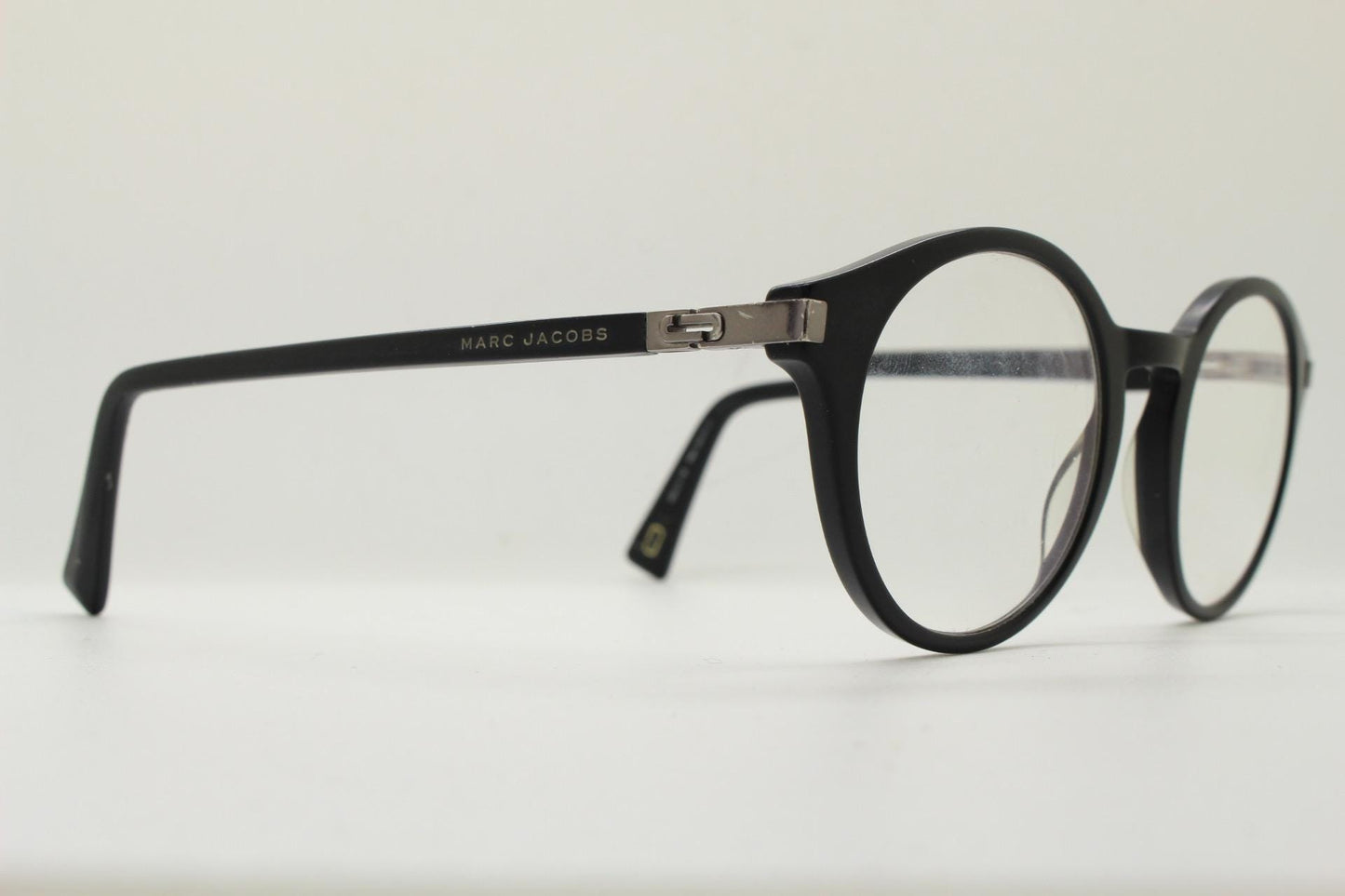 Marc Jacobs round eye glasses in plain black satin finish acetate. Strong fashion look optical frames. Prescription RX spectacles