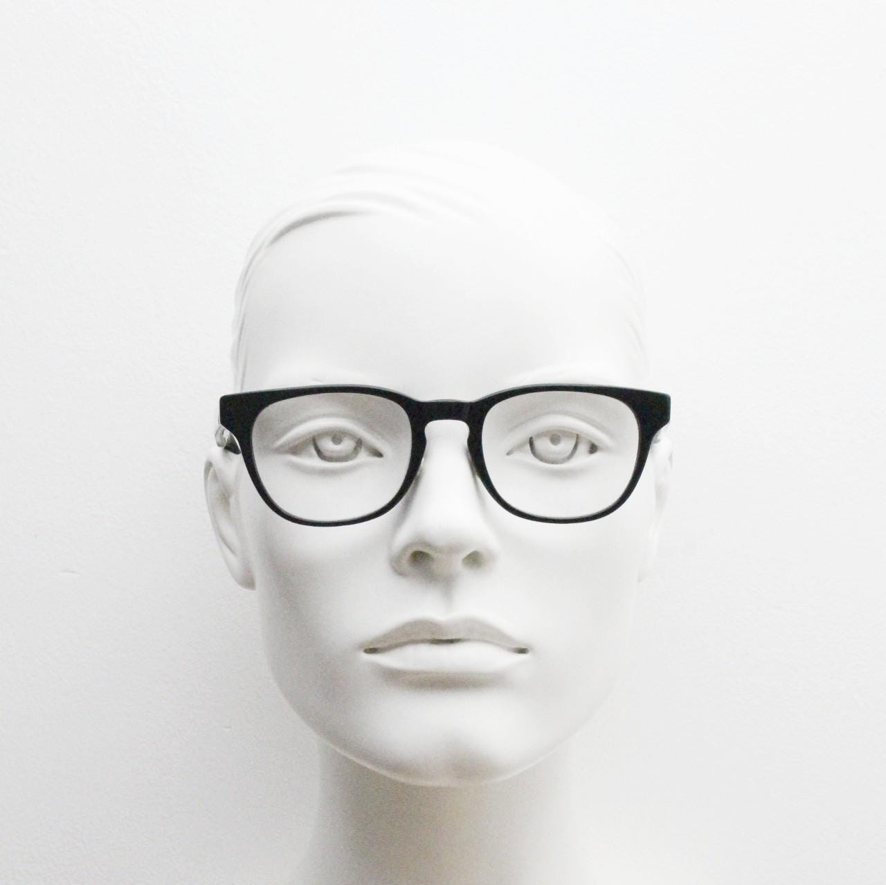 Andi Black rectangular horn rim eye glasses. Black gloss 40s design acetate optical frames with keyhole bridge. Prescription RX spectacles