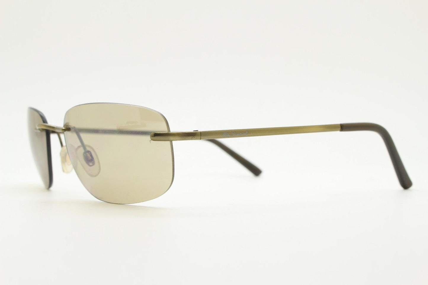 Ben Sherman 90s vintage frameless sunglasses. Minimal brown rectangular lens with brown chrome trim in neat proportions. Mens Mod shades