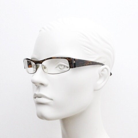 Alain Mikli 90s vintage eye glasses hand made in France. Low profile wrap around half frame in 'wood grain' acetate. Optical prescription RX