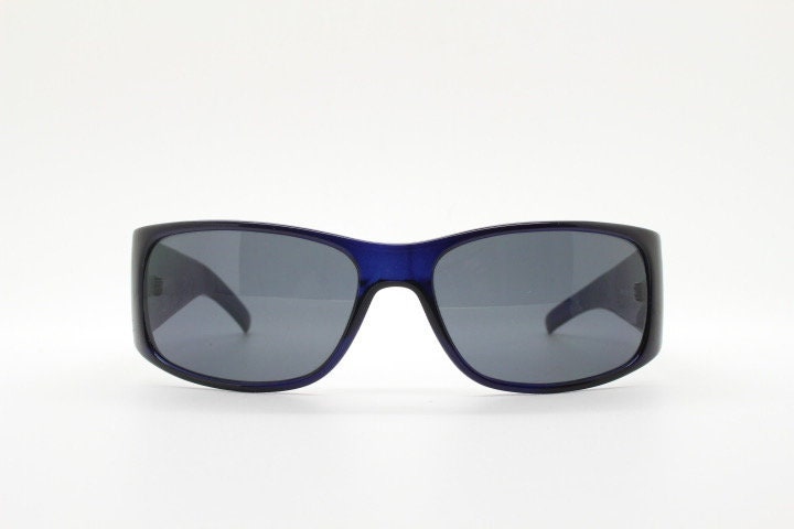 Assoluto 90s vintage wrap around rhinestone shield sunglasses made in Italy. Deep blue acetate frame with dazzling diamante circles. NOS