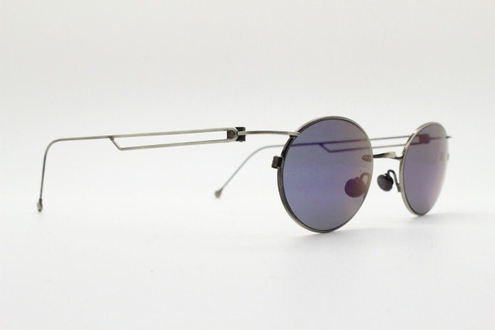 90s vintage oval sunglasses. Refined 'industrial tech' style brushed bronze metal frame with cool blue mirror lenses. Unused NOS