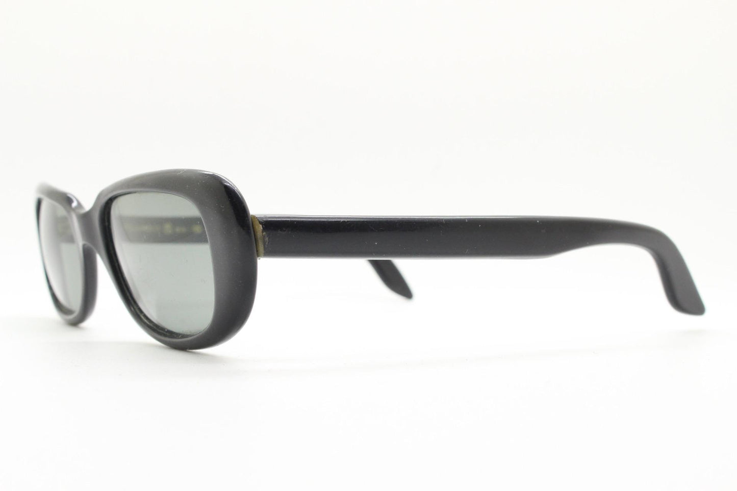 Polaroid 60s vintage rectangular sunglasses made in England. Authentic plain black frame with atmospheric curved lenses. Mens mod